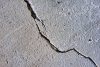 cracked gray concrete surface